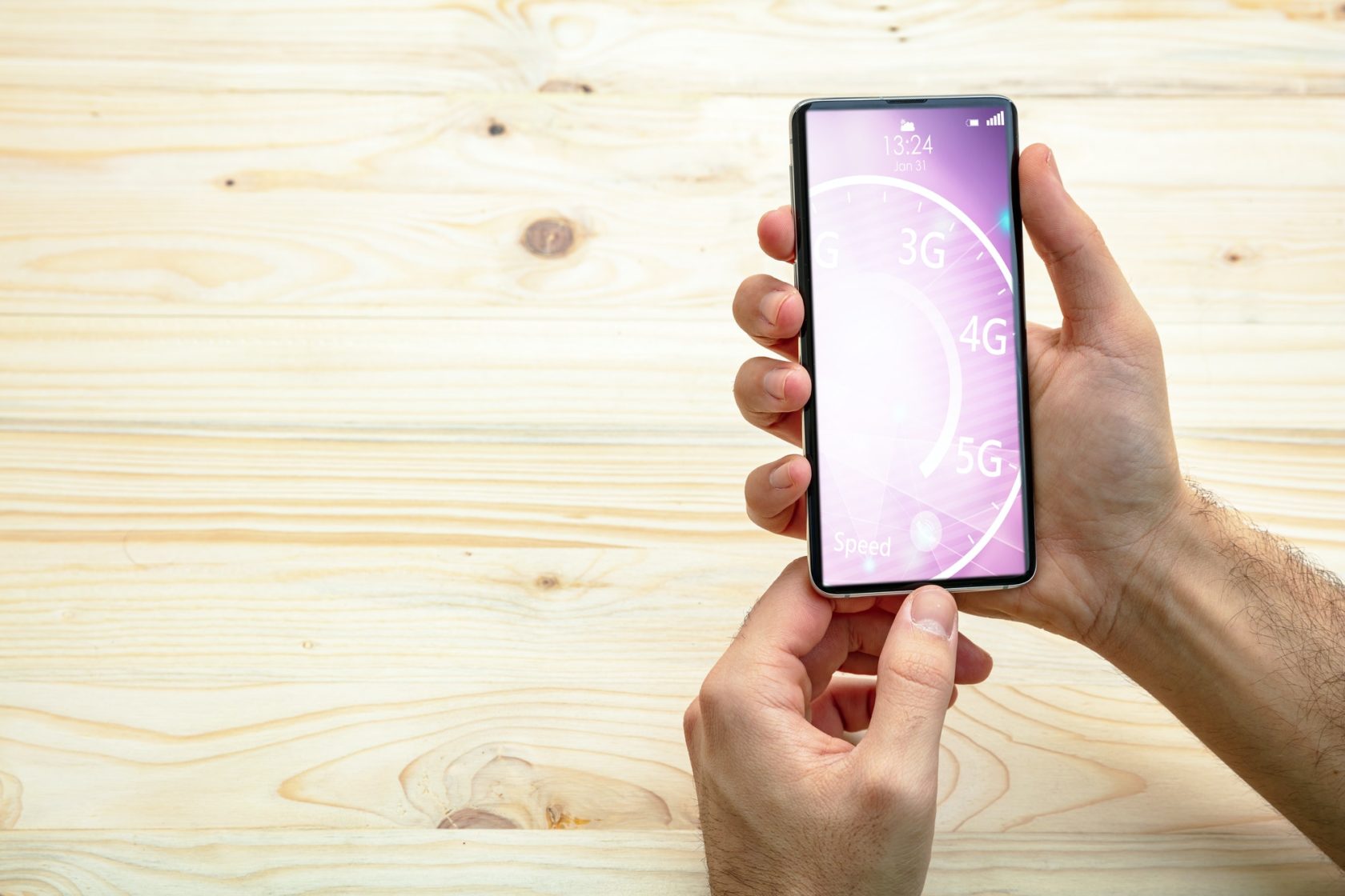 Man holding a smartphone, internet speed test on the screen, wooden background, copy space