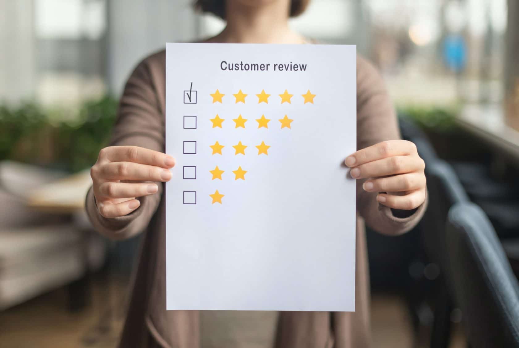 Woman choosing with tick five star rating on paper sheet
