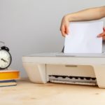 Close up of woman using a printer machine