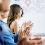 Asian business clapping hands after business meeting successful