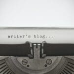 Words “writer’s blog” written with old typewriter