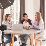 A group of people creating content for social media while making a video