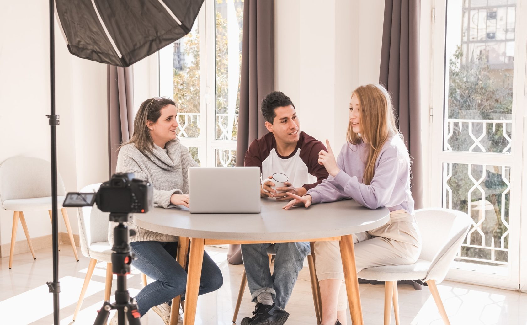 A group of people creating content for social media while making a video