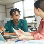 Business couple working with laptop