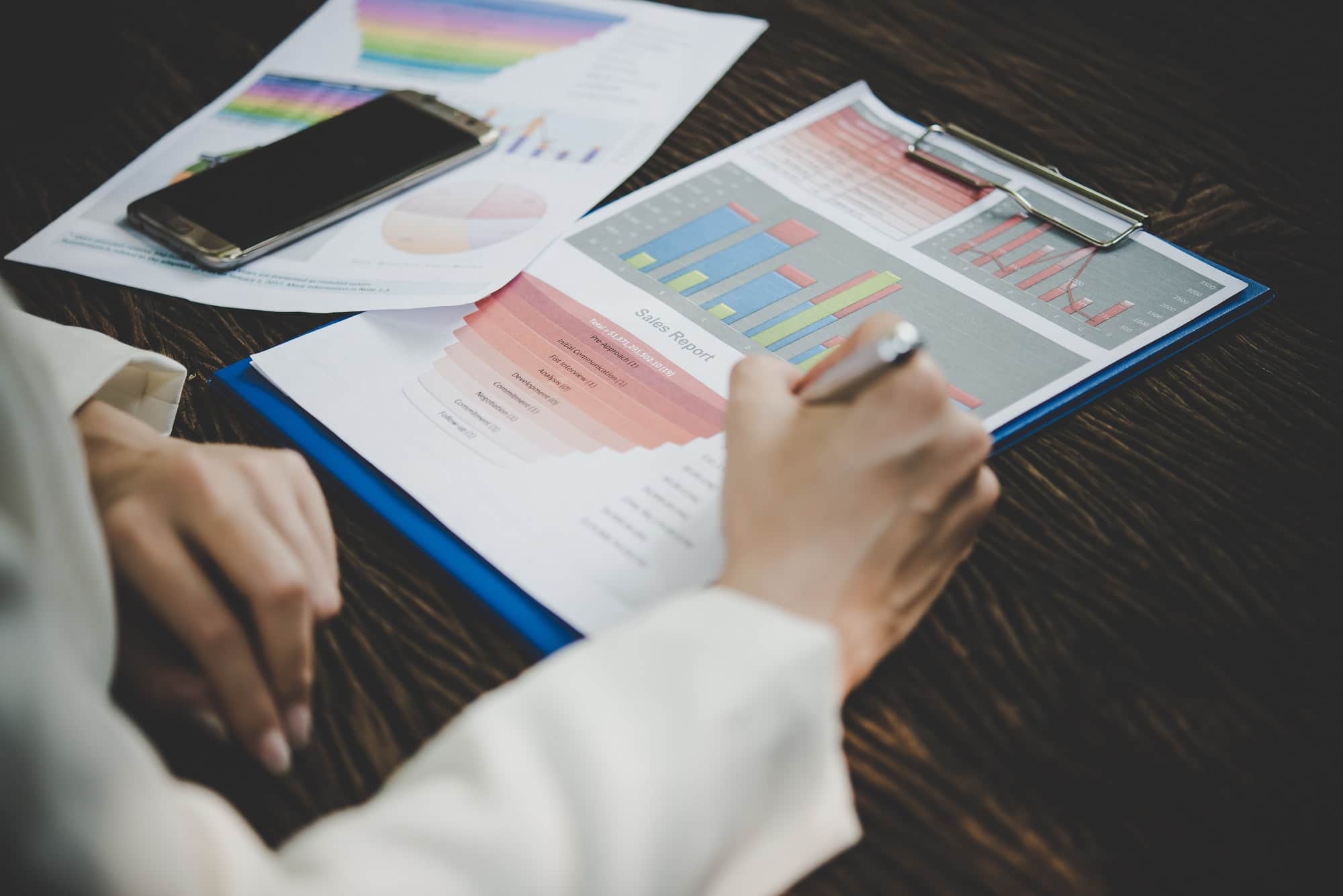 Business woman working with analysis marketing document .