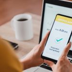 Trader using bitcoin crypto payment service app with mobile phone – Cryptocurrency trend technology