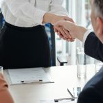 Applicant shaking hands of HR managers