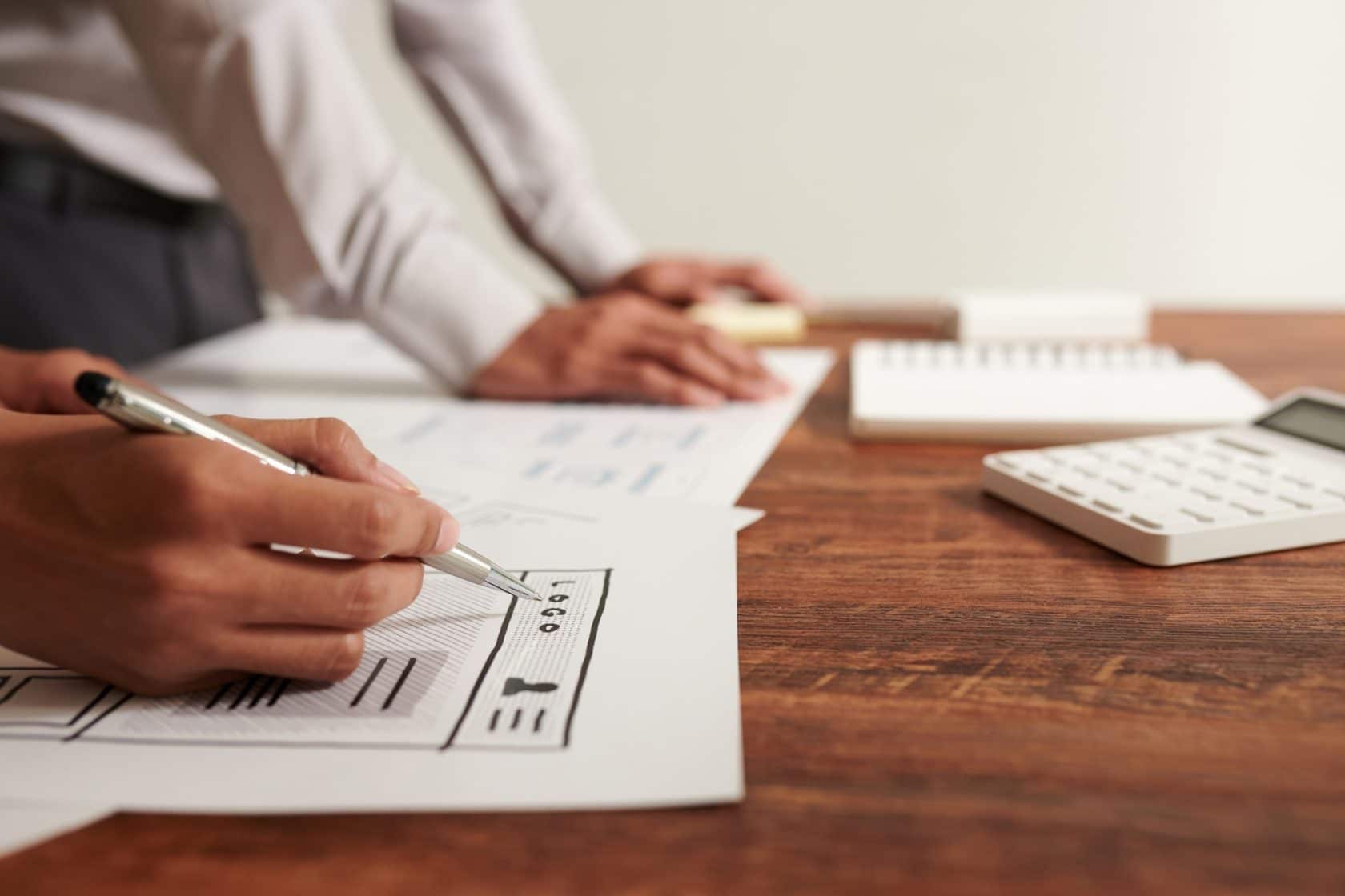 UI Designer Drawing Wireframe of Website