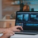 Videographer working remotely editing video footage