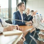 Business people discussing at conference