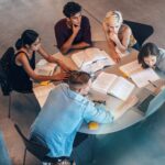 Studying group of students at the table