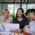 Businesswoman Making Business Presentation For Colleagues In Modern Office