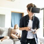 Young boy playing VR game at home