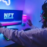 Young gamer buying NFT for metaverse virtual video game online – Focus on augmented reality goggles