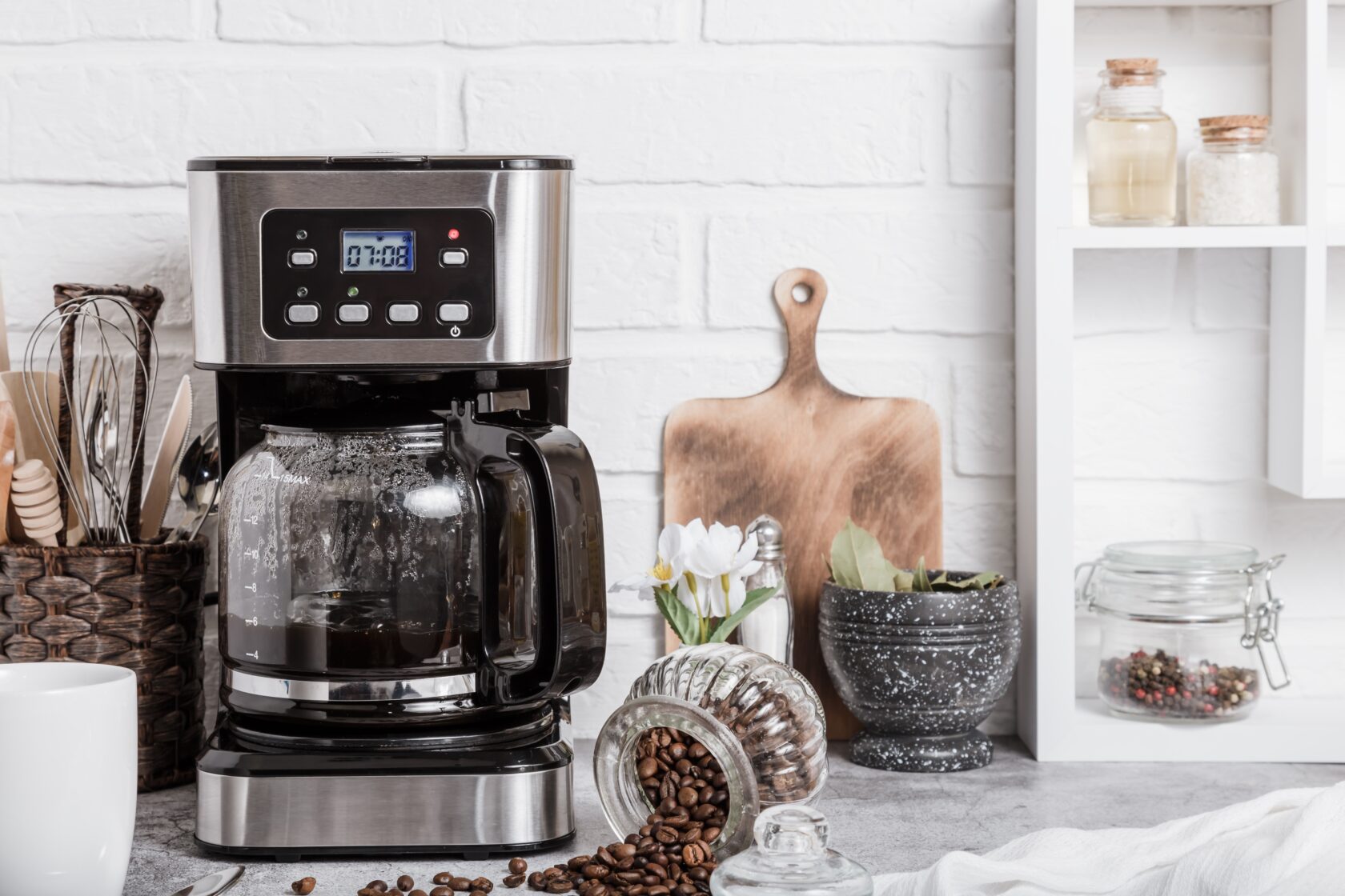 Preparation of hot coffee in the home kitchen in a coffee maker. Household electrical appliances.