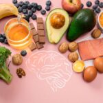 Best foods for brain and memory on pink background. Food for mind and charge of energy.