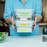 Healthy diet plan for weight loss, daily ready meal menu. Woman holding just cooked lunch boxes