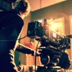 Cameraman holding a camera. Camera crew. Film camera. Digital Camera. Making film. Tv production.