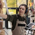 Supervisor wearing headset listening music during inventory