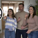 Teenager girl with parents recording dancing for social media